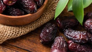 Dates in a wooden bowl