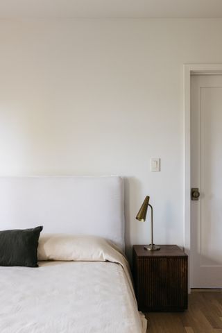 A bedroom with cream walls