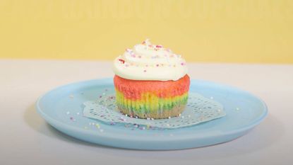 rainbow cupcakes with buttercream frosting on a plate