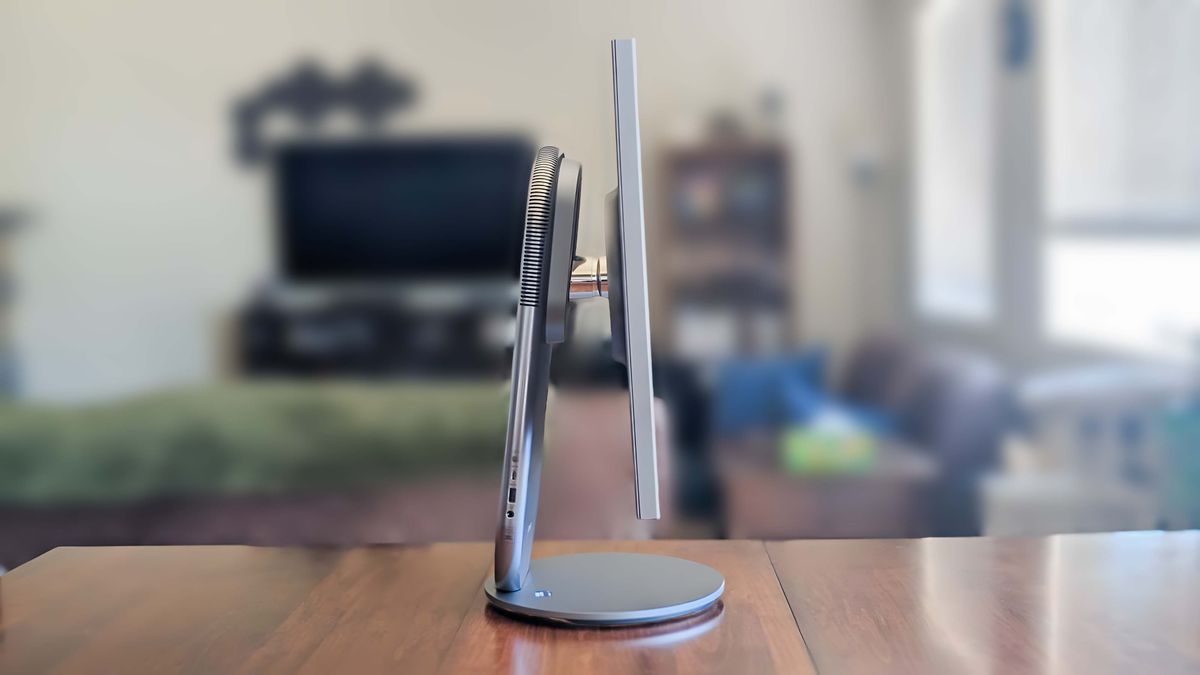 A profile view of the Lenovo Yoga AIO 27" as it sits on a table.