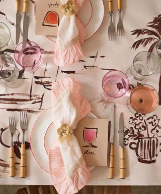 bespoke handpainted tablecloth in chocolate brown with pink accessories for summer entertaining tabletop