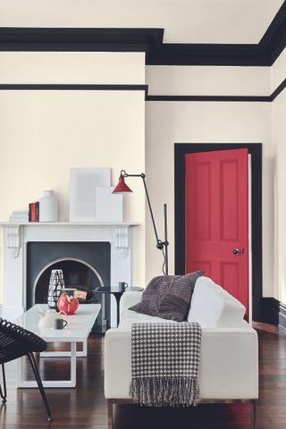 white living room with red door by Little Greene