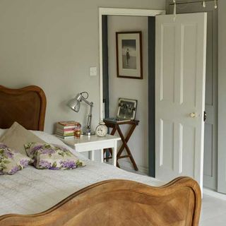 bedroom with white wall and white door