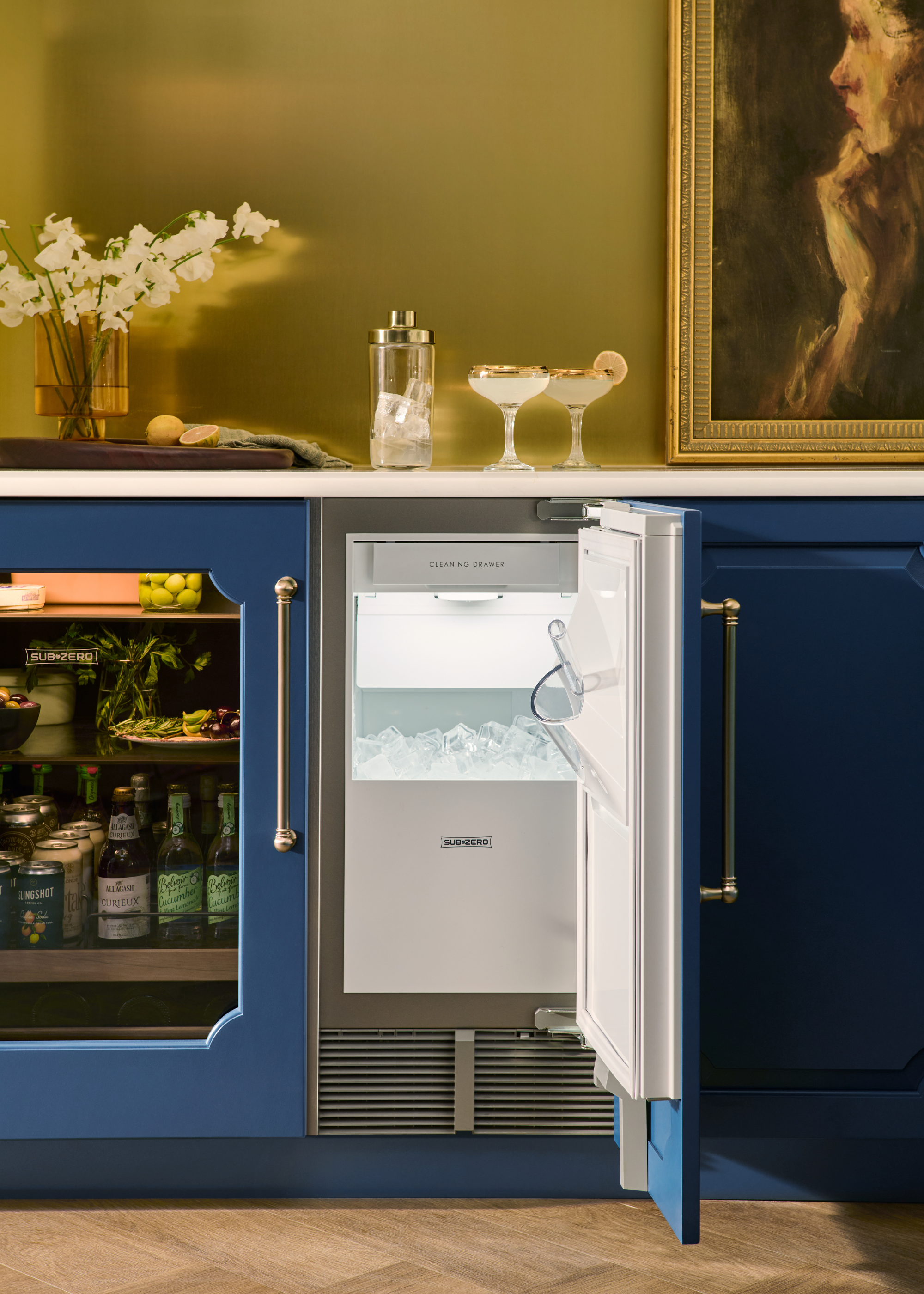 ice fridge under counter in a blue and gold bar