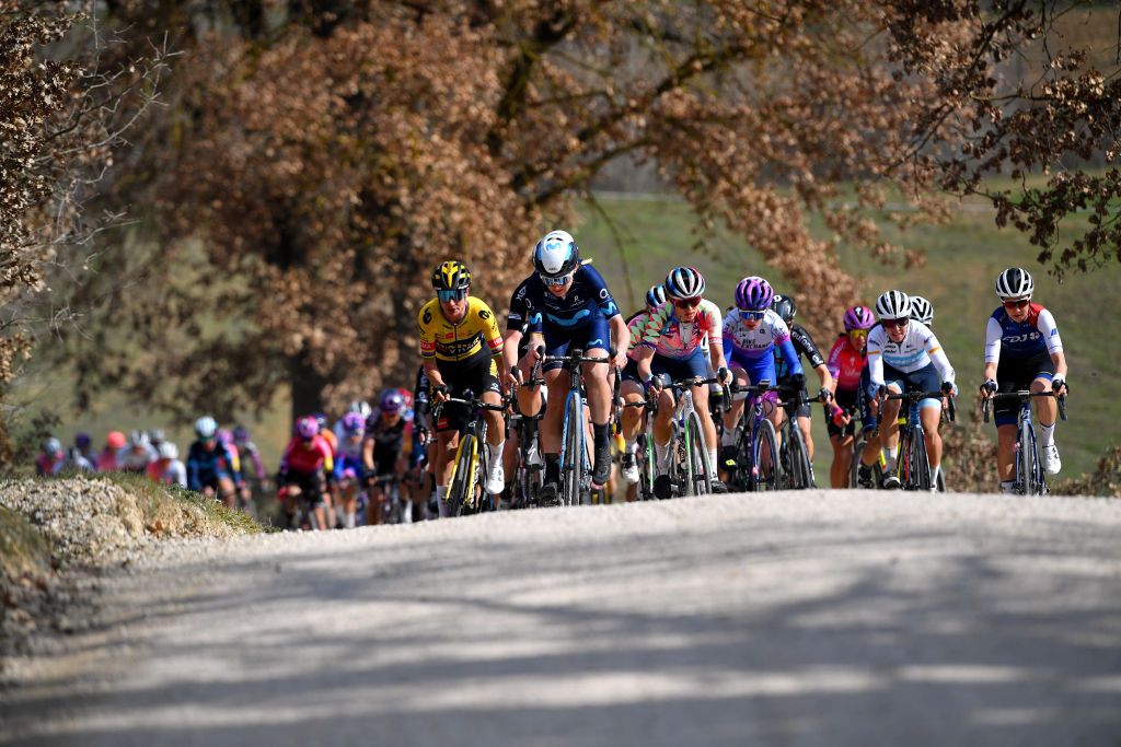 SIENA ITALY MARCH 05 LR Marianne Vos of Netherlands and Team Jumbo Visma Annemiek Van Vleuten of Netherlands and Movistar Team Katarzyna Niewiadoma of Poland and Team Canyon SRAM Racing and the peloton compete during the Eroica 8th Strade Bianche 2022 Womens Elite a 136km one day race from Siena to Siena Piazza del Campo 321m StradeBianche on March 05 2022 in Siena Italy Photo by Luc ClaessenGetty Images