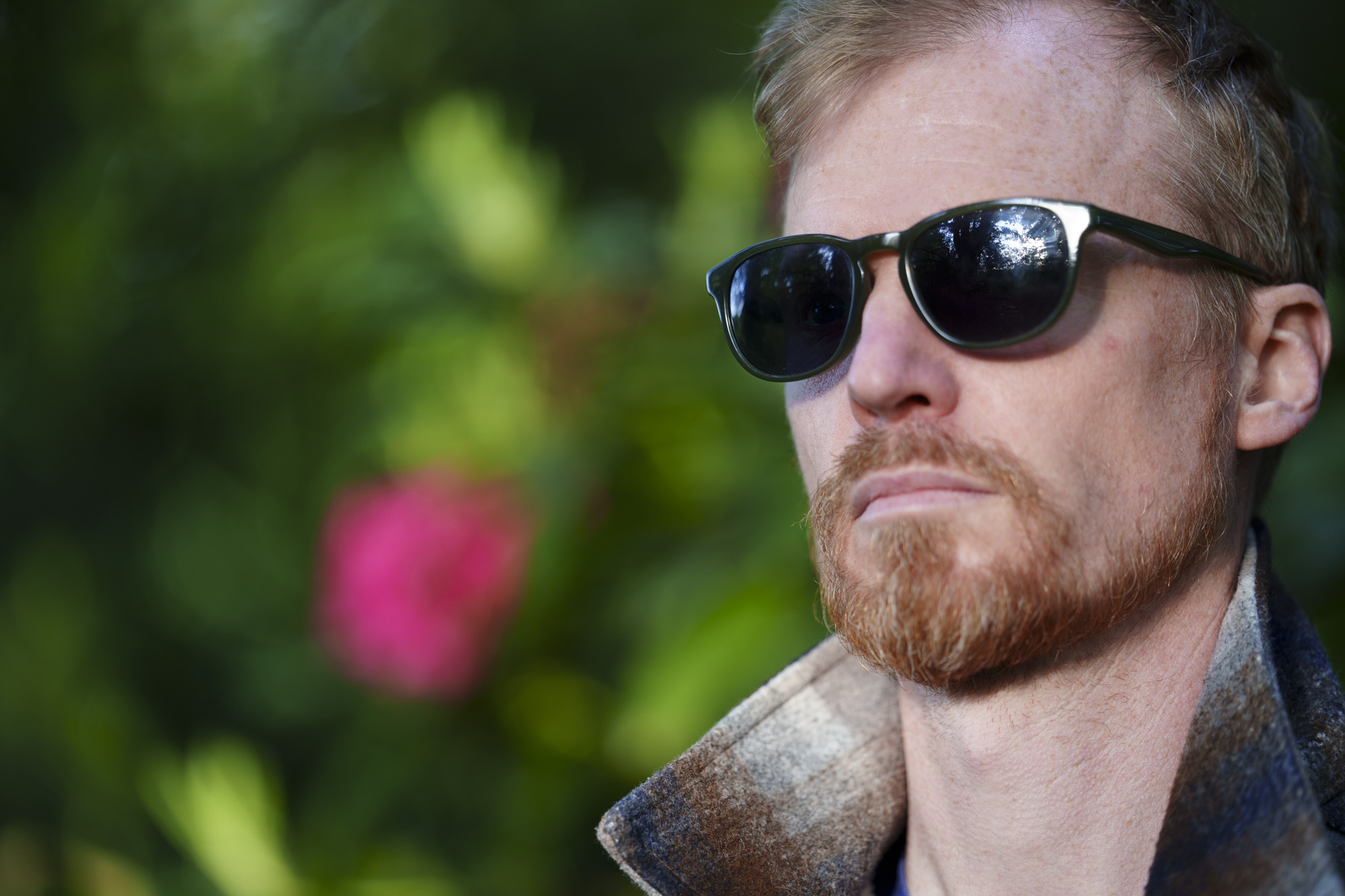 Head and shoulder portrait of a man in sunglasses and jacket, taken with the Sony FE 50-150mm F2 GM lens