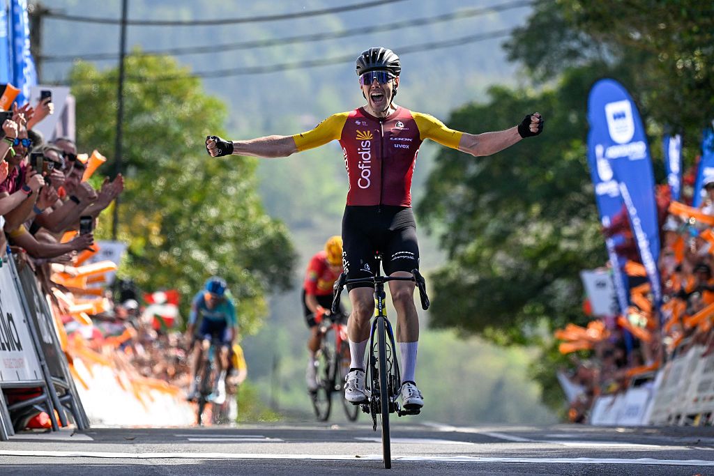 Team Cofidis' Spanish rider Alex Aranburu celebrates as he crosses the finish line to win the fourth stage of the Basque Country's Itzulia. (Photo by ANDER GILLENEA / AFP)