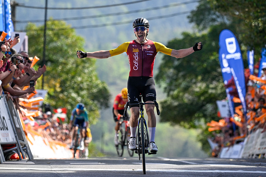 Team Cofidis' Spanish rider Alex Aranburu celebrates as he crosses the finish line to win the fourth stage of the Basque Country's Itzulia cycling tour, a 167.2 km race starting and finishing in Galdakao, on April 9, 2026. (Photo by ANDER GILLENEA / AFP)