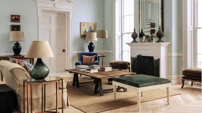 Elegant living room with pale mint walls and vintage furniture