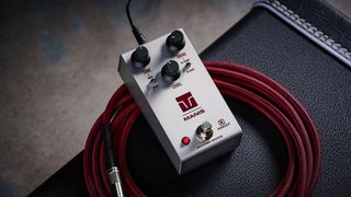 Keeley Electronics Manis: this ingenuous twist ont he K-style overdrive has three-knobs, a couple of mode switches, a tidy white finish and is photographed here against an amp with a red guitar cable.