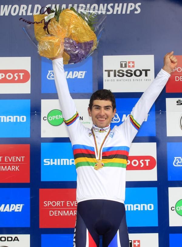 Pierre-Henri Lecuisinier shows off his rainbow jersey