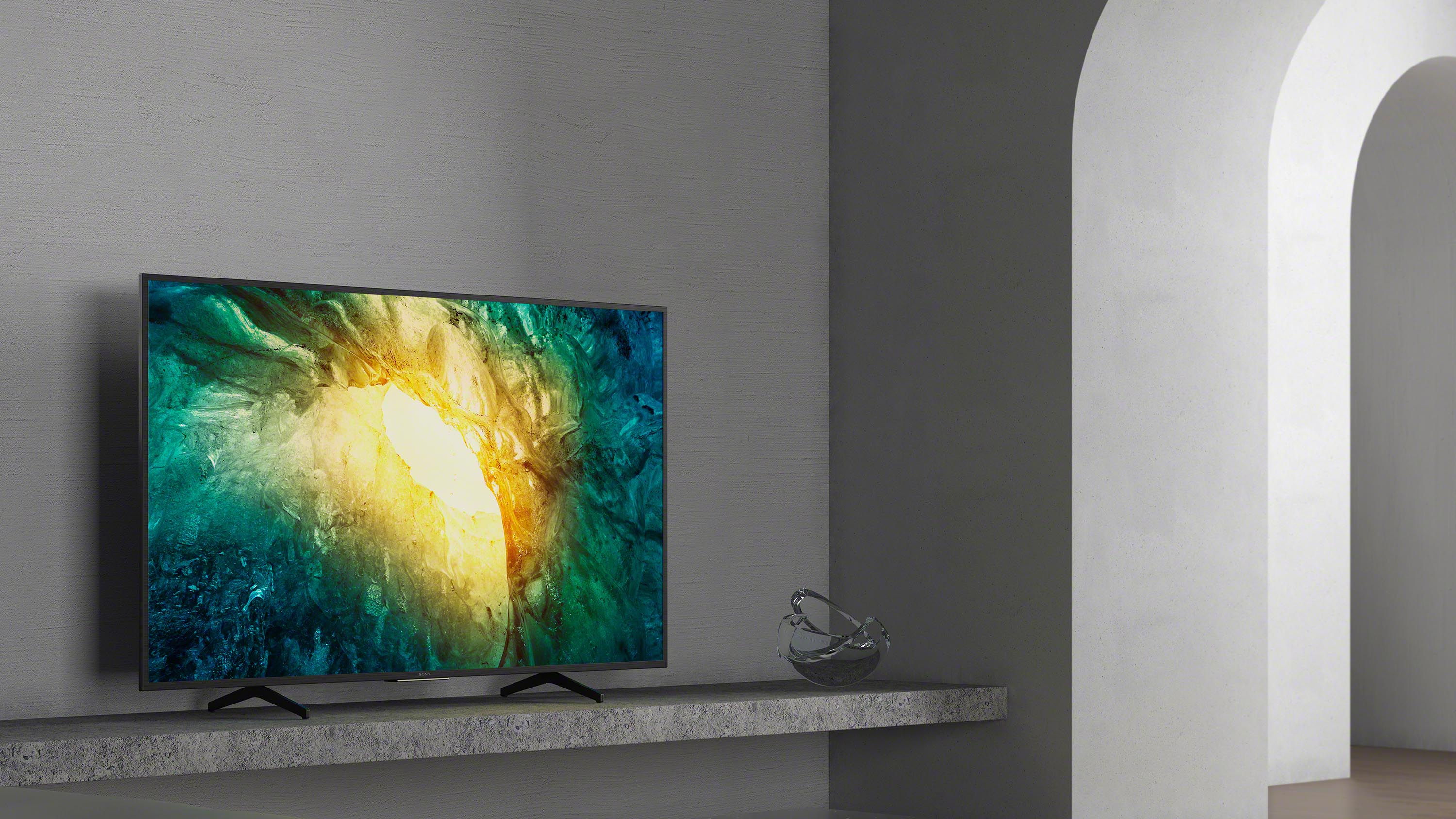 The Sony X70 4K LCD TV in a grey room