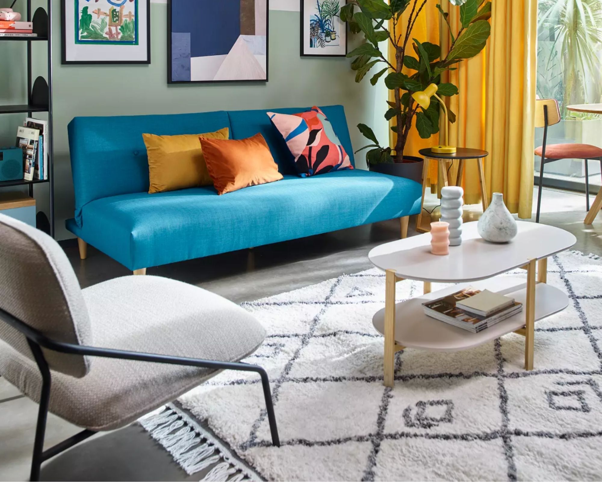 John Lewis & Partners ANYDAY Berber style rug in living room with blue sofa, yellow curtains, striking gallery wall, grey armchair and wooden coffee table