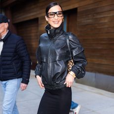 Bella Hadid in leather jacket and skirt