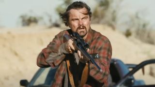 Bob Ferguson (Leonardo DiCaprio) holds his weapon in One Battle After Another