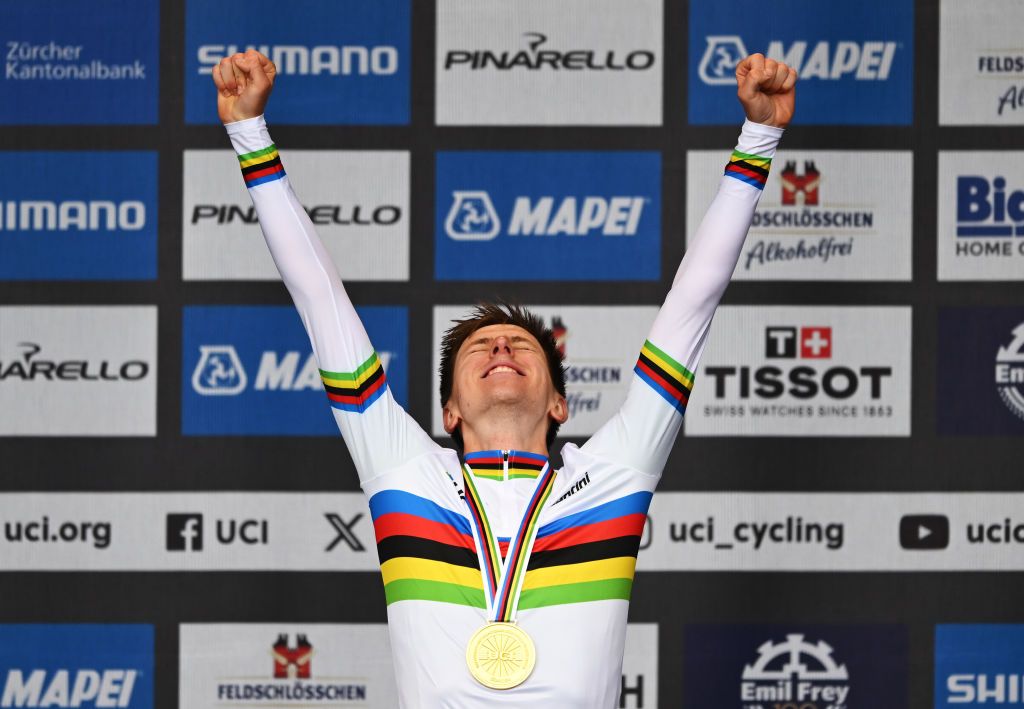 Tadej Pogačar celebrates winning the gold medal in the elite men&#039;s road race