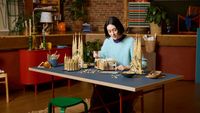 woman building Sagrada Familia Lego set