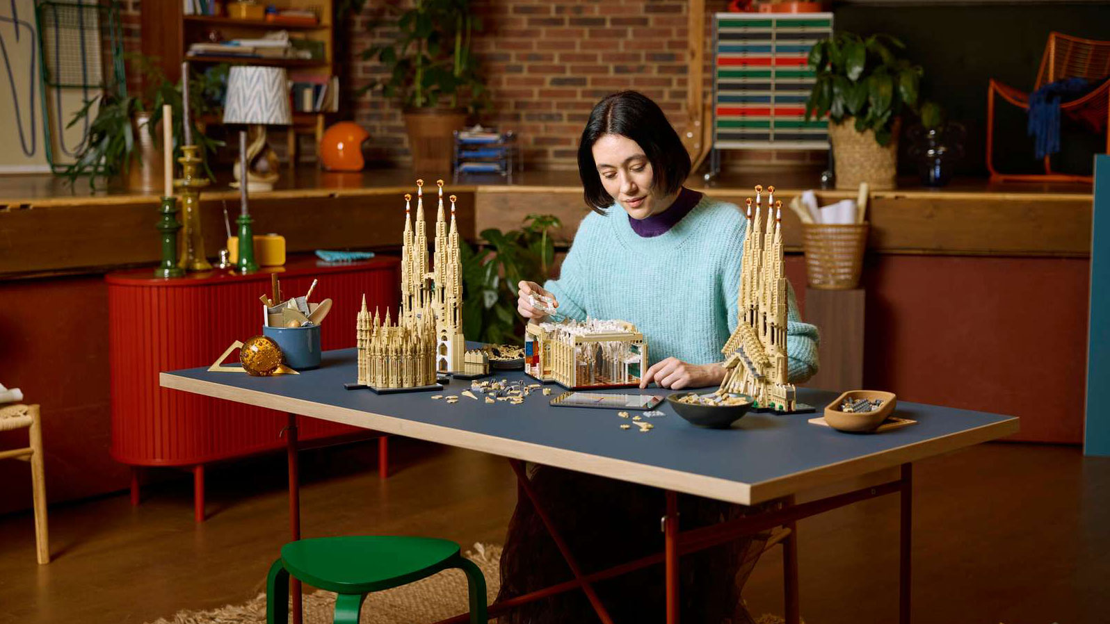 woman building Sagrada Familia Lego set