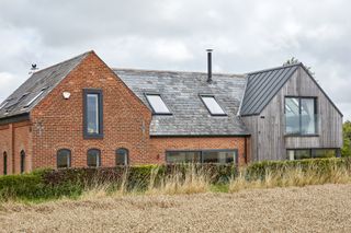 rear shot of timber clad extension to brick converted chapel