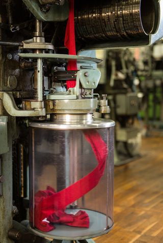 A machine knits a variety of patterns inside the Falke factory