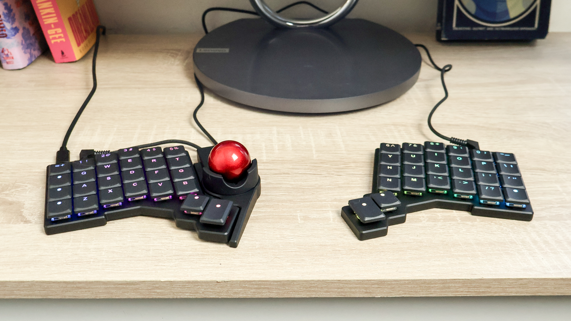ZSA Voyager keyboard with Navigator (trackball) on a desk