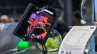 TCL tri-fold phone on a desk