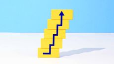 stacked yellow blocks with blue arrow stair-stepping higher