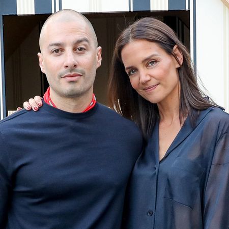 Katie Holmes and her new boyfriend attended Ferragamo in the Hamptons at Topping Rose House, the actress wore a sheer shirt and a fringed skirt