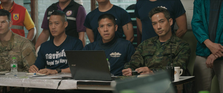 An Acer laptop on a desk in front of military personnel in the film Thirteen Lives.