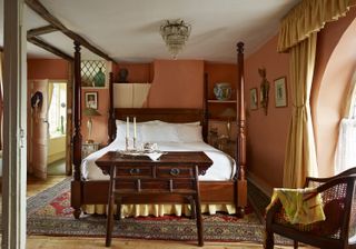 master_bedroom_bed_beams_wooden_furniture_orange_antiques