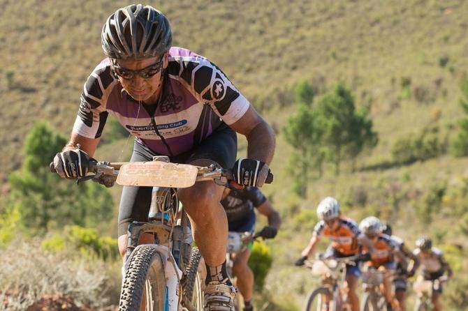 Andrew Mclean of tem Cycle Lab Toyota tries to keep ahead of the leading ladies