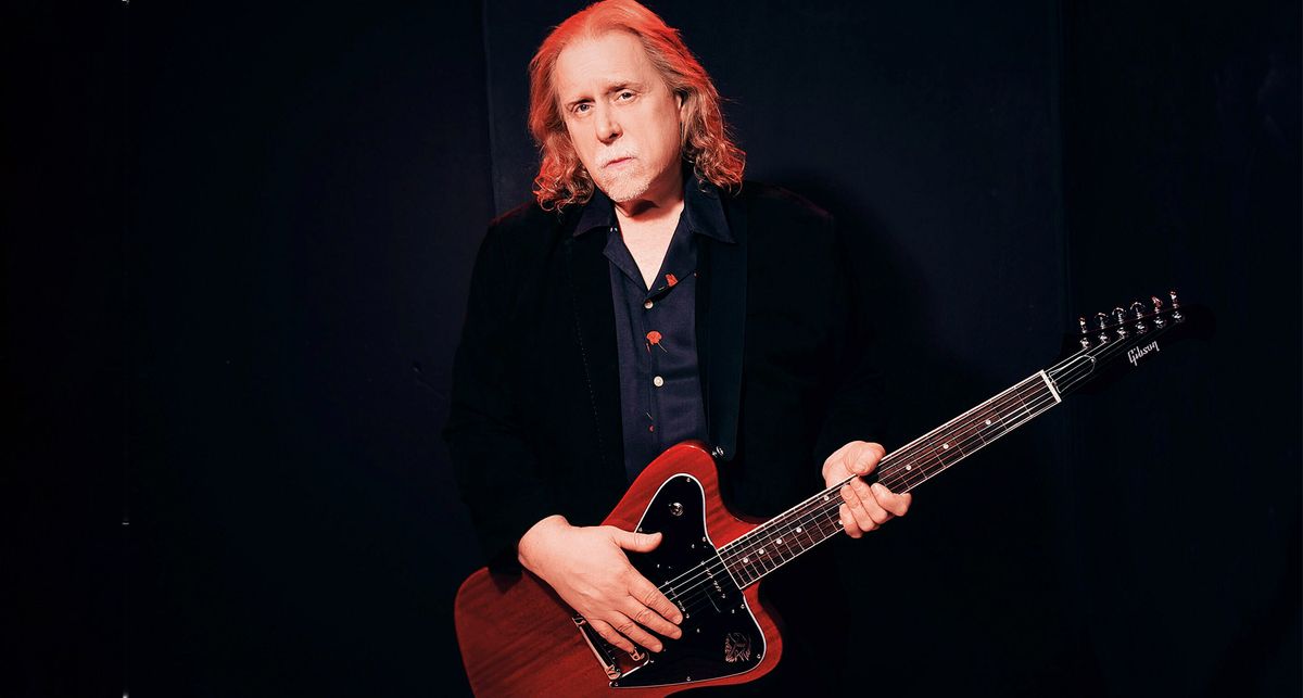 A portrait of Warren Haynes holding a P-90 loaded Gibson Firebird, which the Gov&#039;t Mule frontman and Allman Brothers Band alumnus reveals is a future signature model.