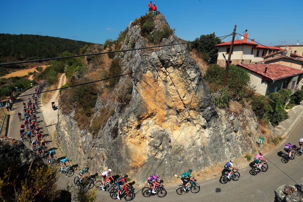 VILLARCAYO SPAIN AUGUST 04 A general view of the peloton passing through a Frias village landscape during the 44th Vuelta a Burgos 2022 Stage 3 a 156km stage from Quintana Martn Galndez to Villarcayo on August 04 2022 in Villarcayo Spain Photo by Gonzalo Arroyo MorenoGetty Images