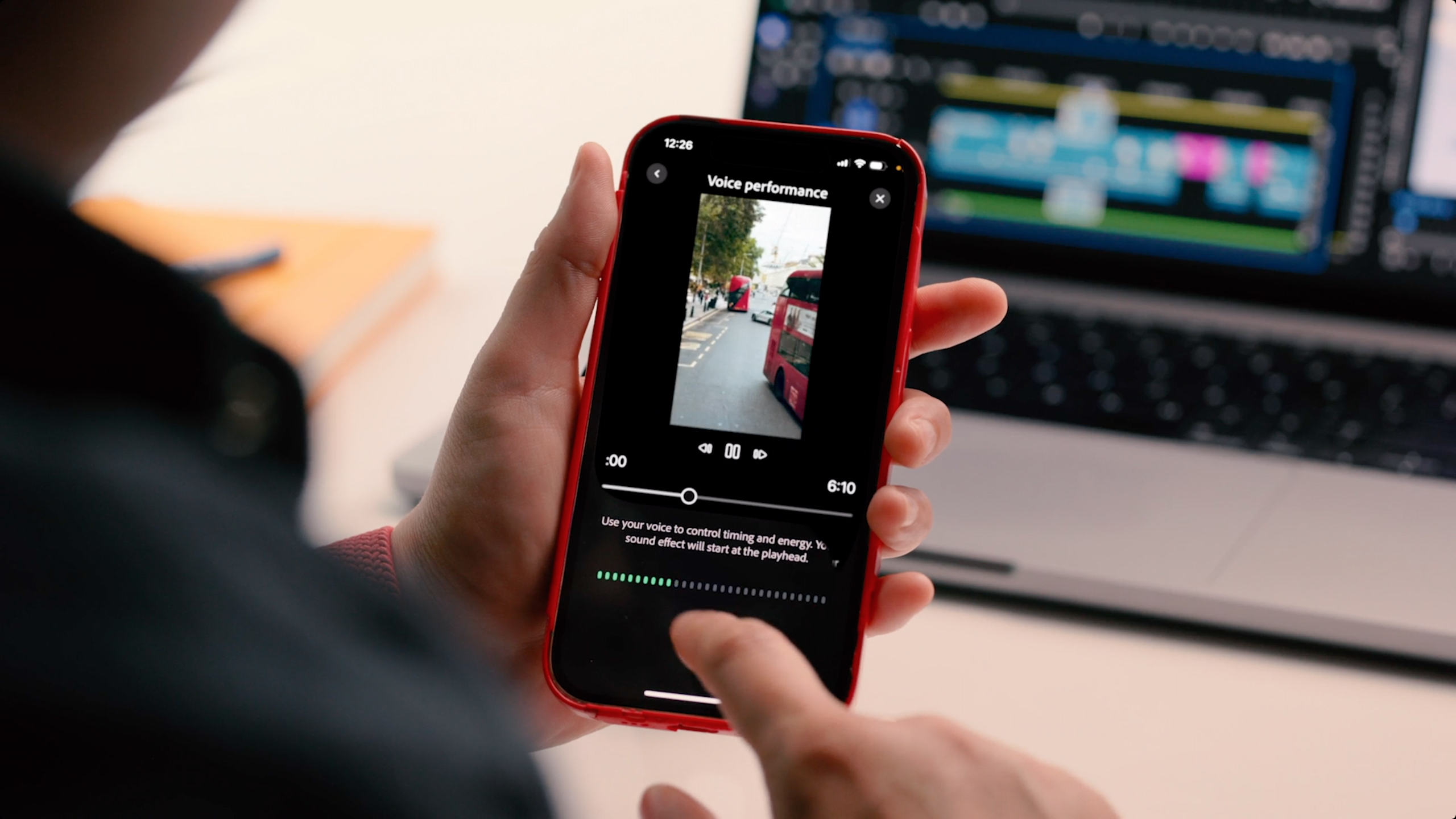 A person uses Adobe Premiere on an iPhone