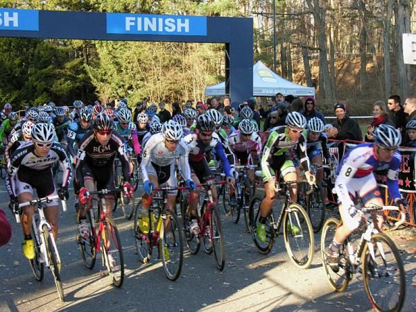The elite men's field charges off the start line.