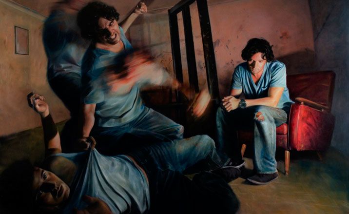 Image of a man in a blue t-shirt and jeans fighting himself