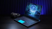 Alienware 16 Area-51 Laptop on desk with headset