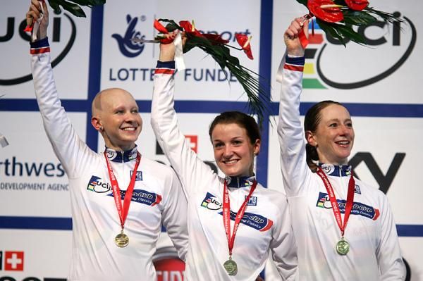 The British team of Joanna Rowsell, Lizzie Armitsted and Wendy Houvenaghel on the podium with gold medals and a new world record