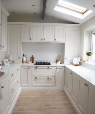 wood effect vinyl flooring in small shaker kitchen