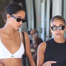 Lori Harvey and Laura Harrier enjoy brunch at Jayde's Market after a joint Pilates class wearing black leggings.