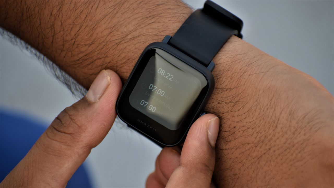 An Amazfit Bip U Pro on someone's wrist