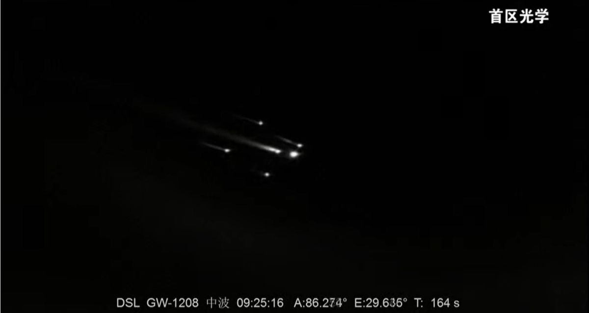 The four rocket boosters and core stage of China's Long March 2F rocket separate from its upper stage (right) during the successful Shenzhou 12 crew launch to the country's new space station.
