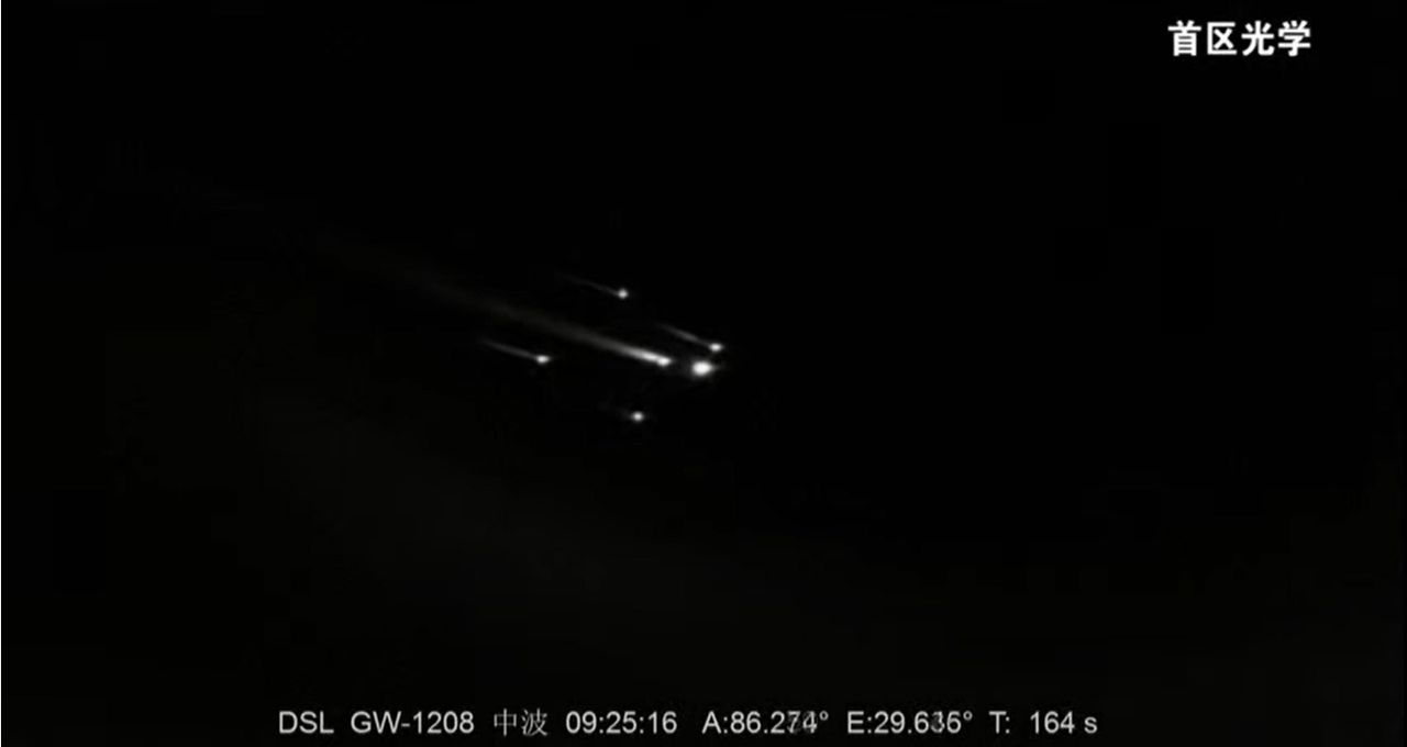 The four rocket boosters and core stage of China's Long March 2F rocket separate from its upper stage (right) during the successful Shenzhou 12 crew launch to the country's new space station.