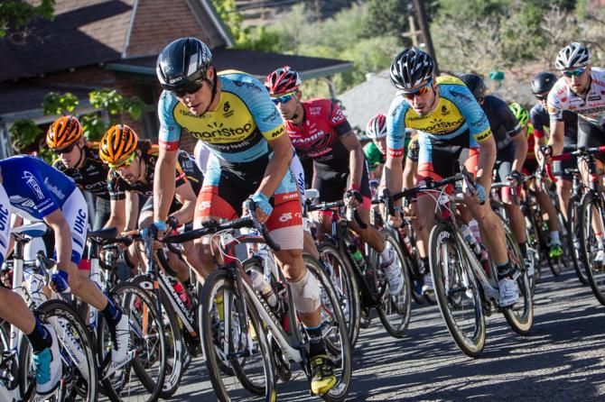 Travis McCabe (Smartstop) brings teammate Zach Bell towards the front on the final laps.