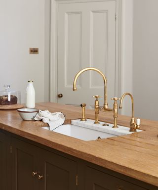 brass faucet and taps in a devol kitchen