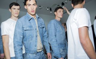 Four models wearing Calvin Klien fashion, two wearing denim and two in white T-shirs