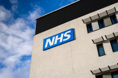 View of the NHS (National Health Service) logo at the Springfields Medical Centre in the centre of Warrington, Cheshire.