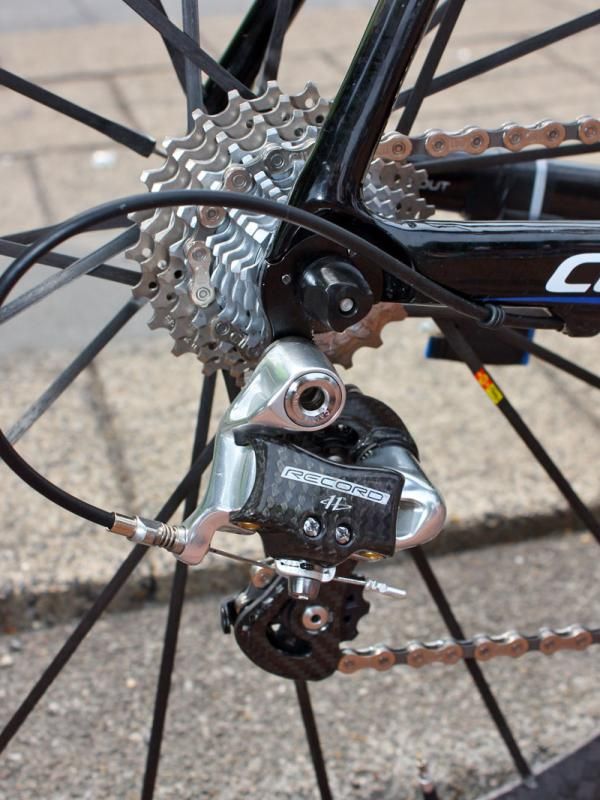The Campagnolo Record rear derailleur moves the chain over steel and titanium cogs.