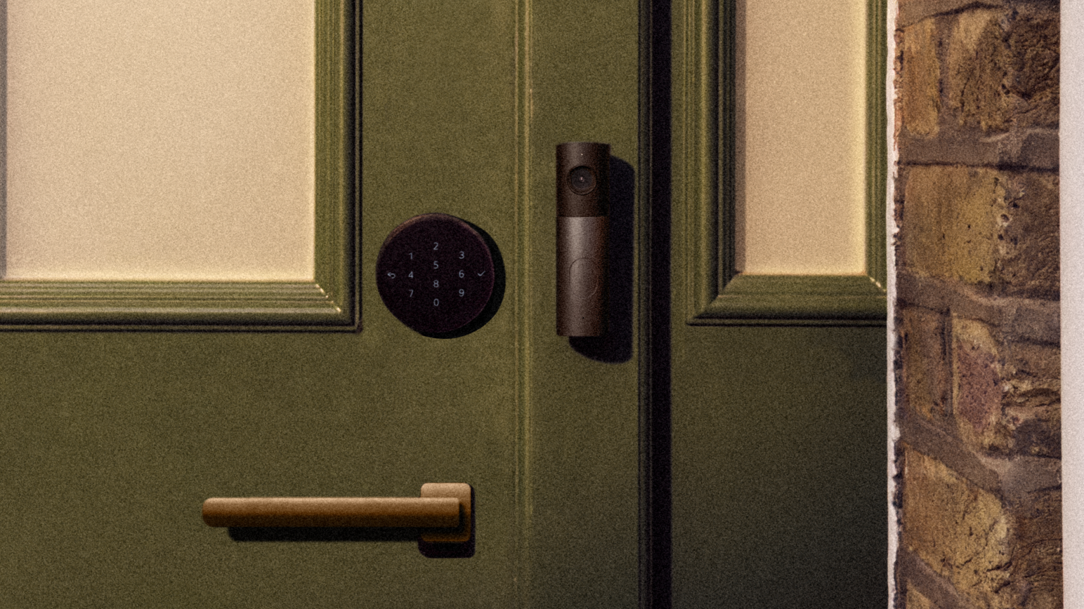 LG Video Doorbell and LG Smart Deadbolt Lock from Apple Home Collection on Green Door