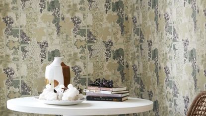 Madeaux trellis wallpaper with white table and collection of vases